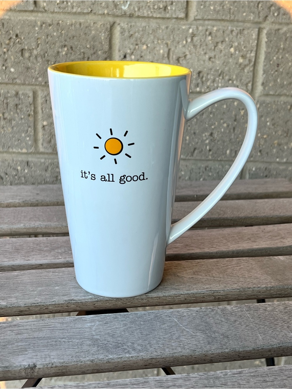 White Ceramic Mug with Yellow Interior and Sun Graphic
